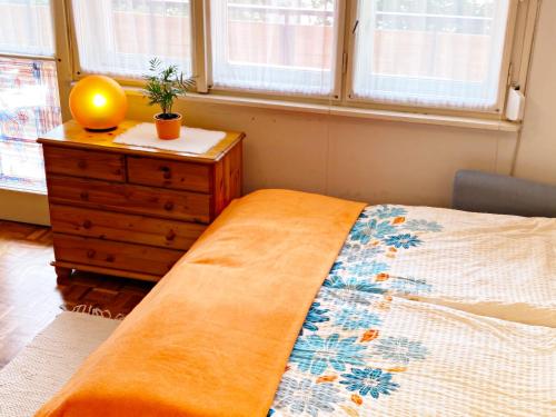 Posteľ alebo postele v izbe v ubytovaní Sétány Apartman
