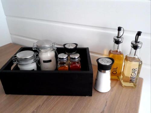 a black box filled with different types of condiments at Ferienwohnung Neustadt-Wied in Neustadt