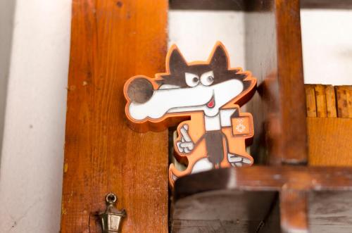 a cartoon cat sticker on the door of a room at Guest House Time Out in Sarajevo