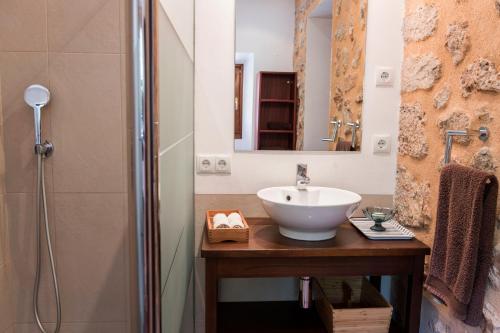 a bathroom with a sink and a shower at Raco de Soller in Sóller