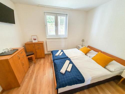 Postel nebo postele na pokoji v ubytování Rekreačné zariadenie Bojnice - Nad Zámkom