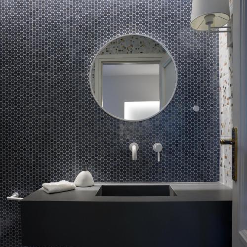 a bathroom with a sink and a mirror at Ambeli Luxury Villa in Megalokhori