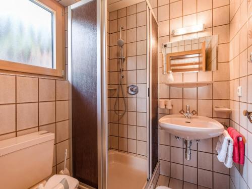 a bathroom with a sink and a shower at Gästehaus Geisler in Hippach