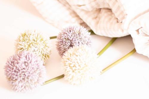 a group of pom poms on a white table with a towel at Haus Sonnwend in Sölden