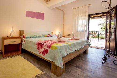 Postel nebo postele na pokoji v ubytování Apartmani Jurman