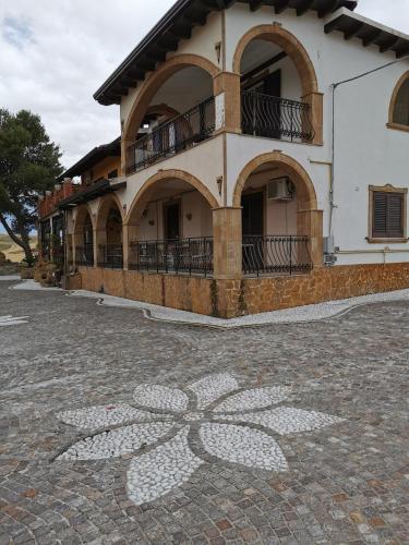 a building with a flower painted on the ground at Agriturismo Reggia Saracena in Agrigento