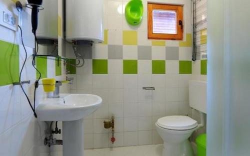 a bathroom with a sink and a toilet at Apartments Mizo in Ohrid