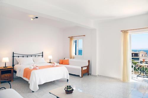 Ένα ή περισσότερα κρεβάτια σε δωμάτιο στο Agistri Apartments
