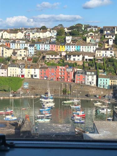 a group of boats are docked in a harbor at Beacon House B&B Brixham in Brixham
