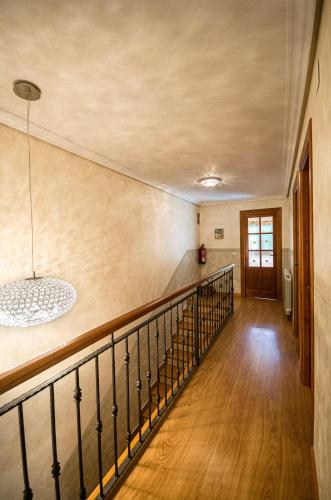 a hallway of a house with a stair railing at Casa Almoravid in Daroca de Rioja