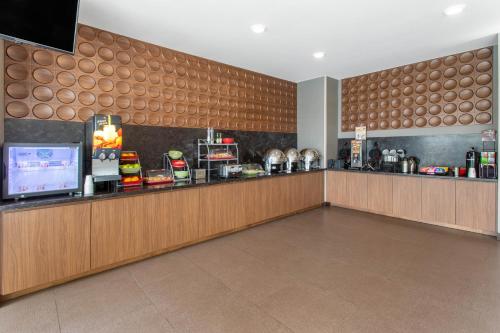 a fast food restaurant with a counter with a food at Hawthorn Extended Stay by Wyndham Loveland in Johnstown