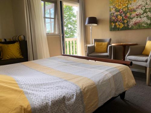 Кровать или кровати в номере Bed & Breakfast "Bij Lucie"