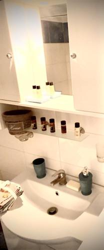 a bathroom with a sink and a mirror at Kallithea studio in Kallithea Halkidikis