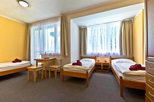 Lova arba lovos apgyvendinimo įstaigoje Resort Luna Vysočina