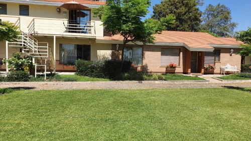 a house with a lawn in front of it at La Casita de Fraida in Guadalajara