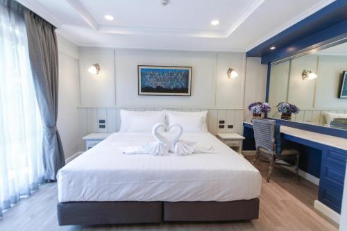 Una cama o camas en una habitación de Rimwiang