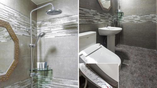 a bathroom with a sink and a toilet and a mirror at Onda D'oro Hostel in Yeosu