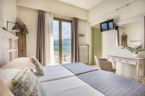 Postel nebo postele na pokoji v ubytování Tourist Boutique Hotel