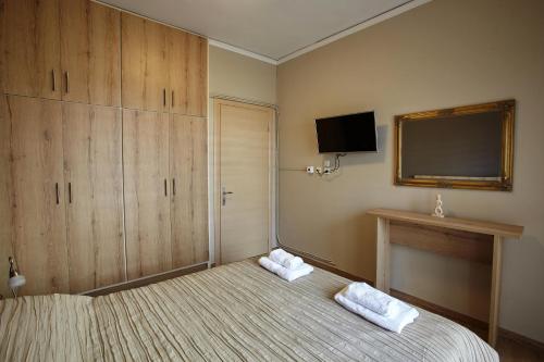 Posteľ alebo postele v izbe v ubytovaní C.L.A. City Loux Apartment