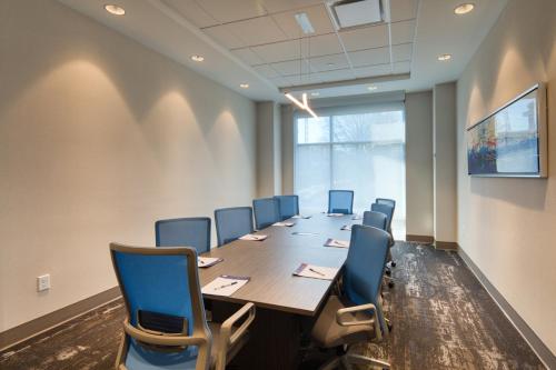 a conference room with a long table and chairs at Holiday Inn Express & Suites - Charlotte - South End by IHG in Charlotte