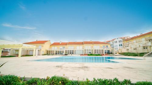 a large swimming pool in a courtyard of a building at Casa da Azenha Terrace Prime in Santa Cruz