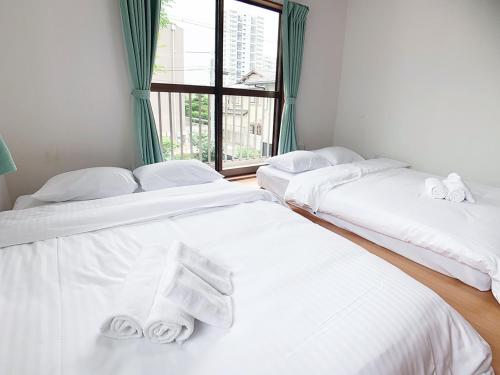 Letto o letti in una camera di Itsukaichi First Villa Hiroshima