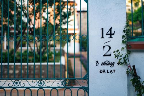a sign on the side of a wrought iron gate at La Em Boutique Villa in Da Lat