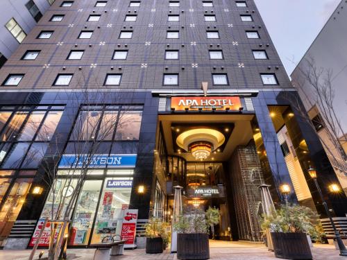 a building with aania hotel in front of it at APA Hotel Hiroshima Ekimae Ohashi in Hiroshima