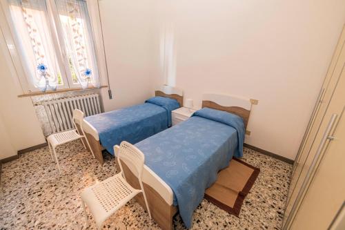 Кровать или кровати в номере Casa Vacanze Cattolica