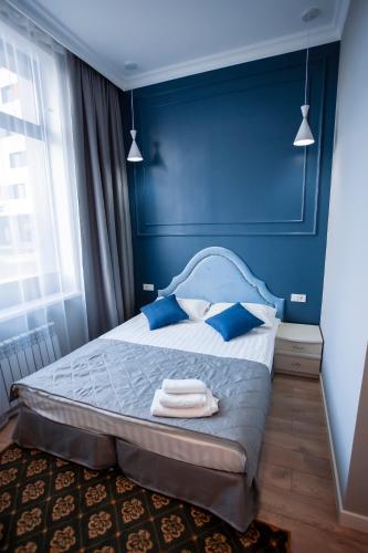 Postel nebo postele na pokoji v ubytování ARENA Hotel
