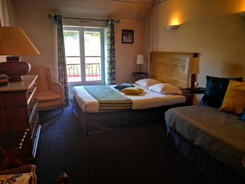 Ένα ή περισσότερα κρεβάτια σε δωμάτιο στο Hostellerie du Val d'Or