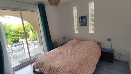 Posteľ alebo postele v izbe v ubytovaní Bambou entre Mer et Montagnes
