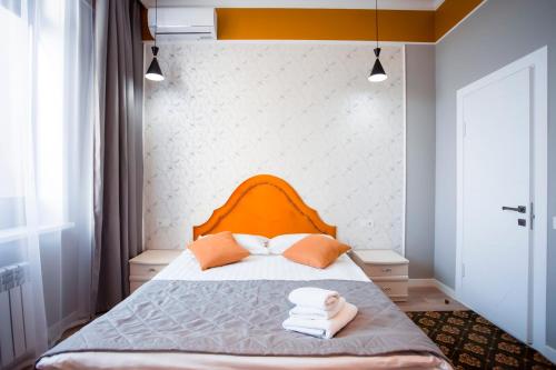 Postel nebo postele na pokoji v ubytování ARENA Hotel