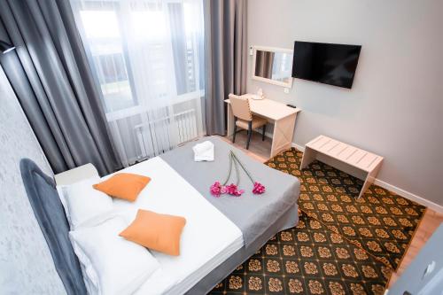 Postel nebo postele na pokoji v ubytování ARENA Hotel