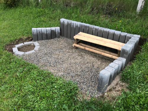 a bench sitting on top of a patch of grass at Apartmán NA KOPCI Krucemburk in Křížová
