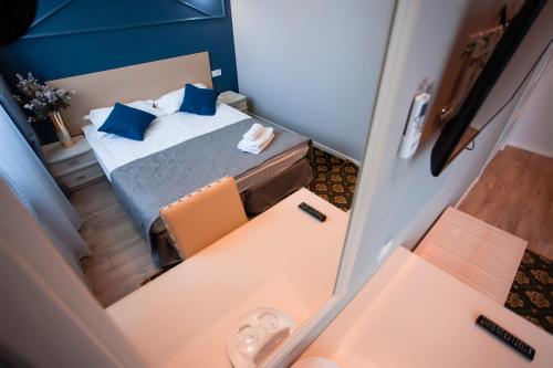 Postel nebo postele na pokoji v ubytování ARENA Hotel