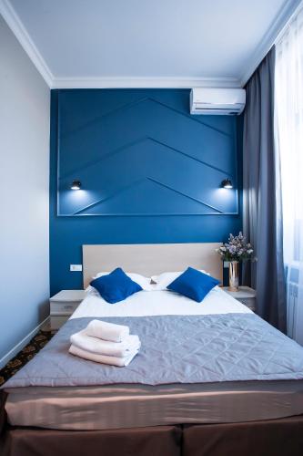 Postel nebo postele na pokoji v ubytování ARENA Hotel