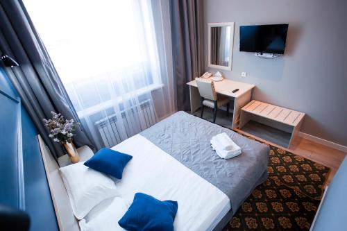 Postel nebo postele na pokoji v ubytování ARENA Hotel