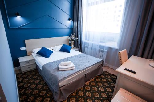 Postel nebo postele na pokoji v ubytování ARENA Hotel