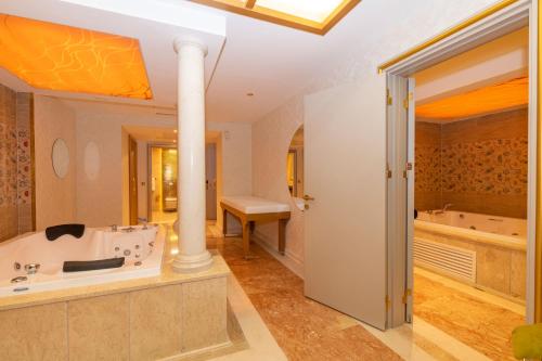 a bathroom with a tub and a sink at Wyndham Istanbul Old City in Istanbul