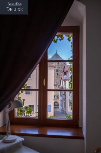 a window with a view of a building at ApartOne Altstadt-Hotel in Bautzen