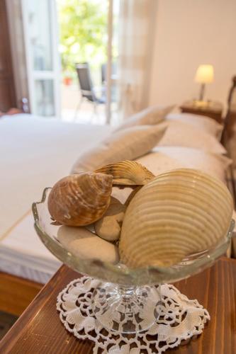 a glass bowl filled with shells on a table at Historic center Hvar town- a few steps from the main square in Hvar