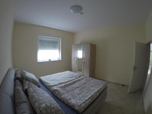 Ένα ή περισσότερα κρεβάτια σε δωμάτιο στο Ferienhaus RUTH