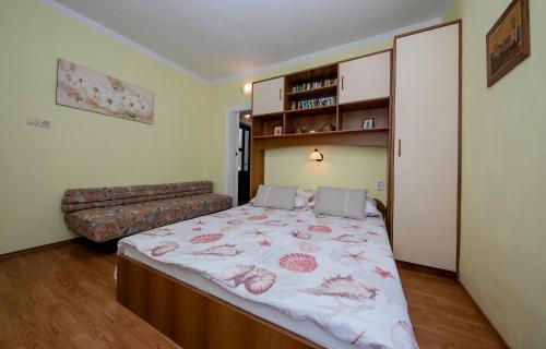 Postel nebo postele na pokoji v ubytování Apartments Debelić
