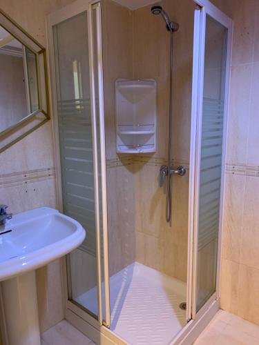 a bathroom with a shower and a sink at Roca Chica Torremolinos in Torremolinos