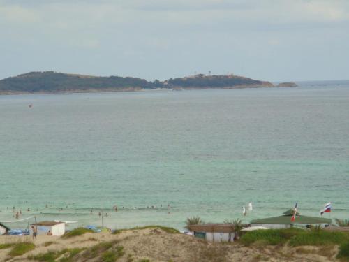 a group of people in the water at a beach at ТРОПИКАНА in Primorsko