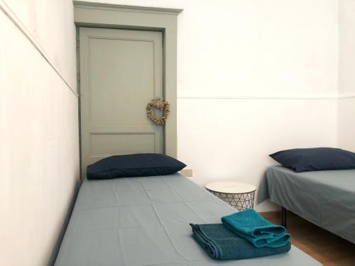 Postelja oz. postelje v sobi nastanitve Marie Maison Sicilienne