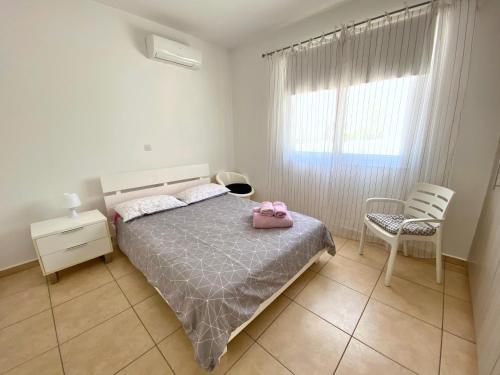 Säng eller sängar i ett rum på Mythical Sands Resort - Good Vibes Apartment