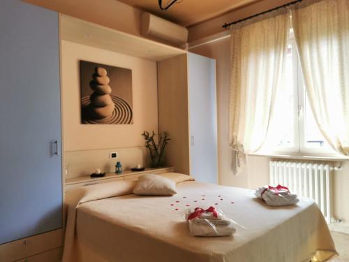 En eller flere senge i et værelse på Villa Consorti