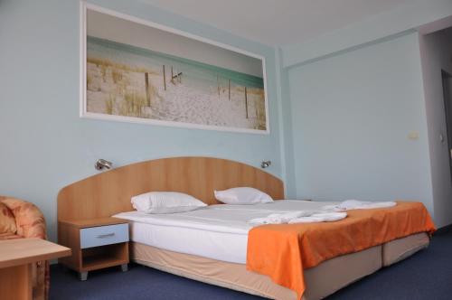 Postel nebo postele na pokoji v ubytování Hotel BelleVille